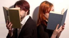 Photo of two people reading books