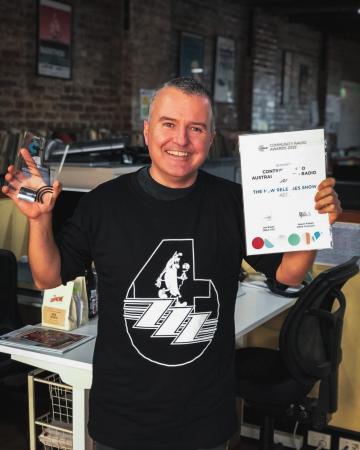 Chris Cobcroft with his Community Radio Award trophy